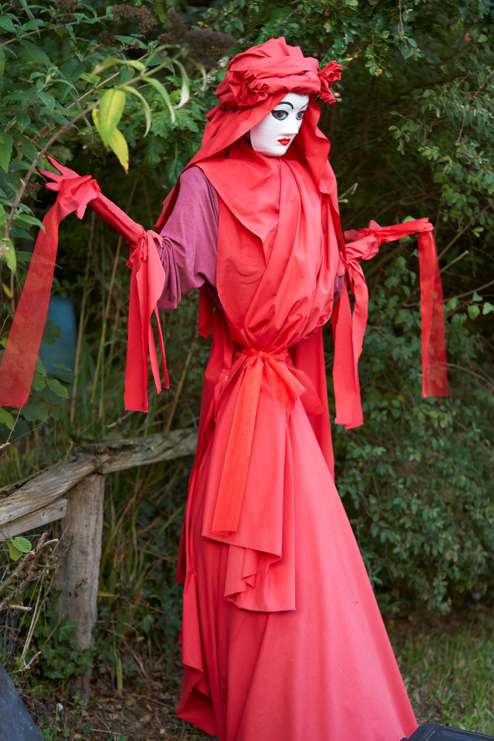red lady scarecrow
